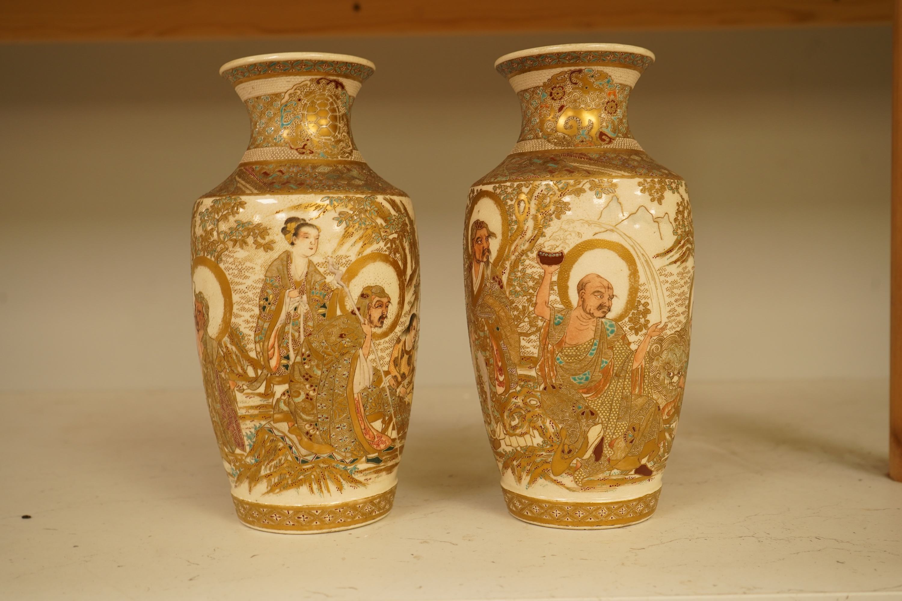 A pair of Japanese Satsuma ‘rakan’ vases, Meiji period, 21cm